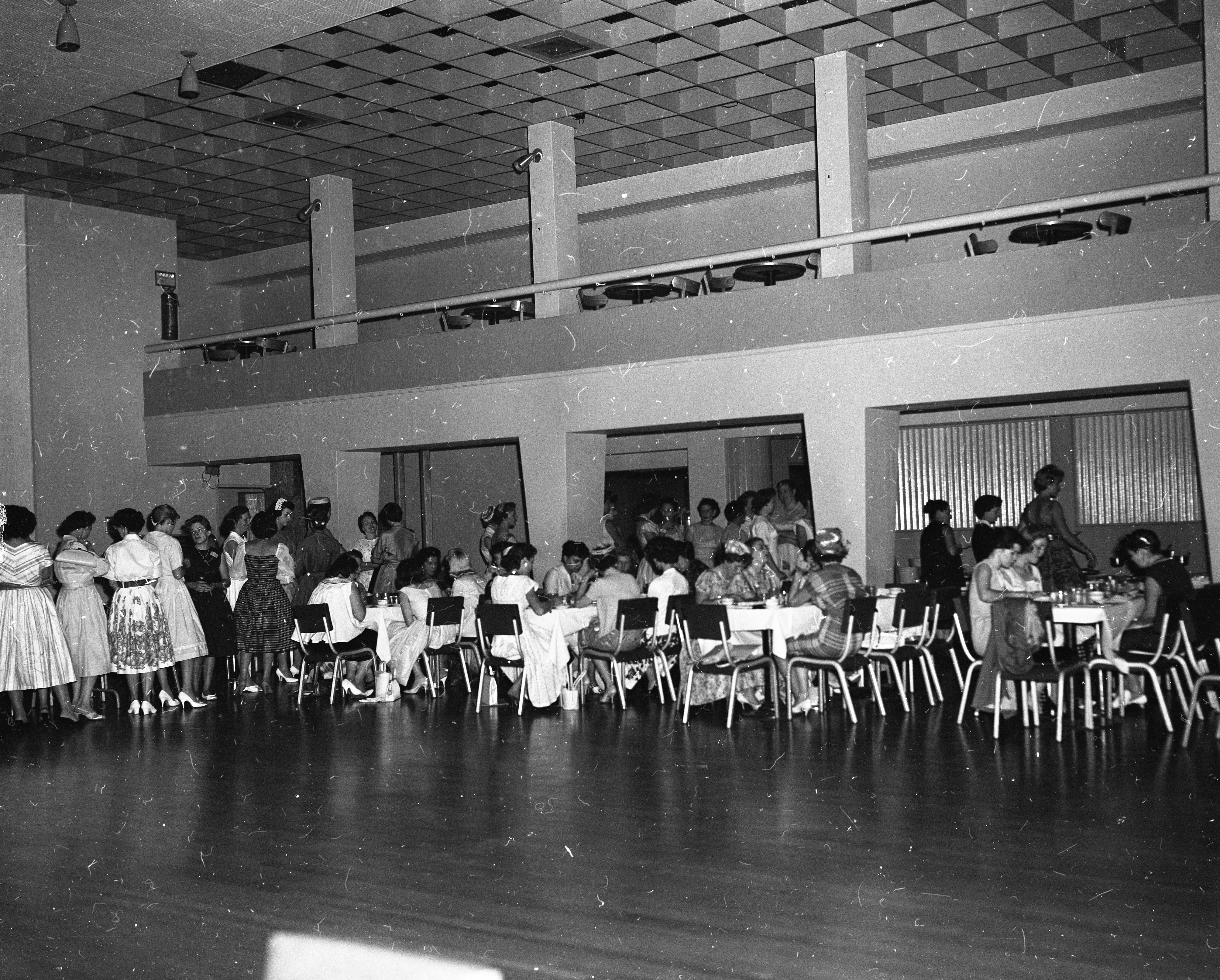 Women eating during the luncheon.